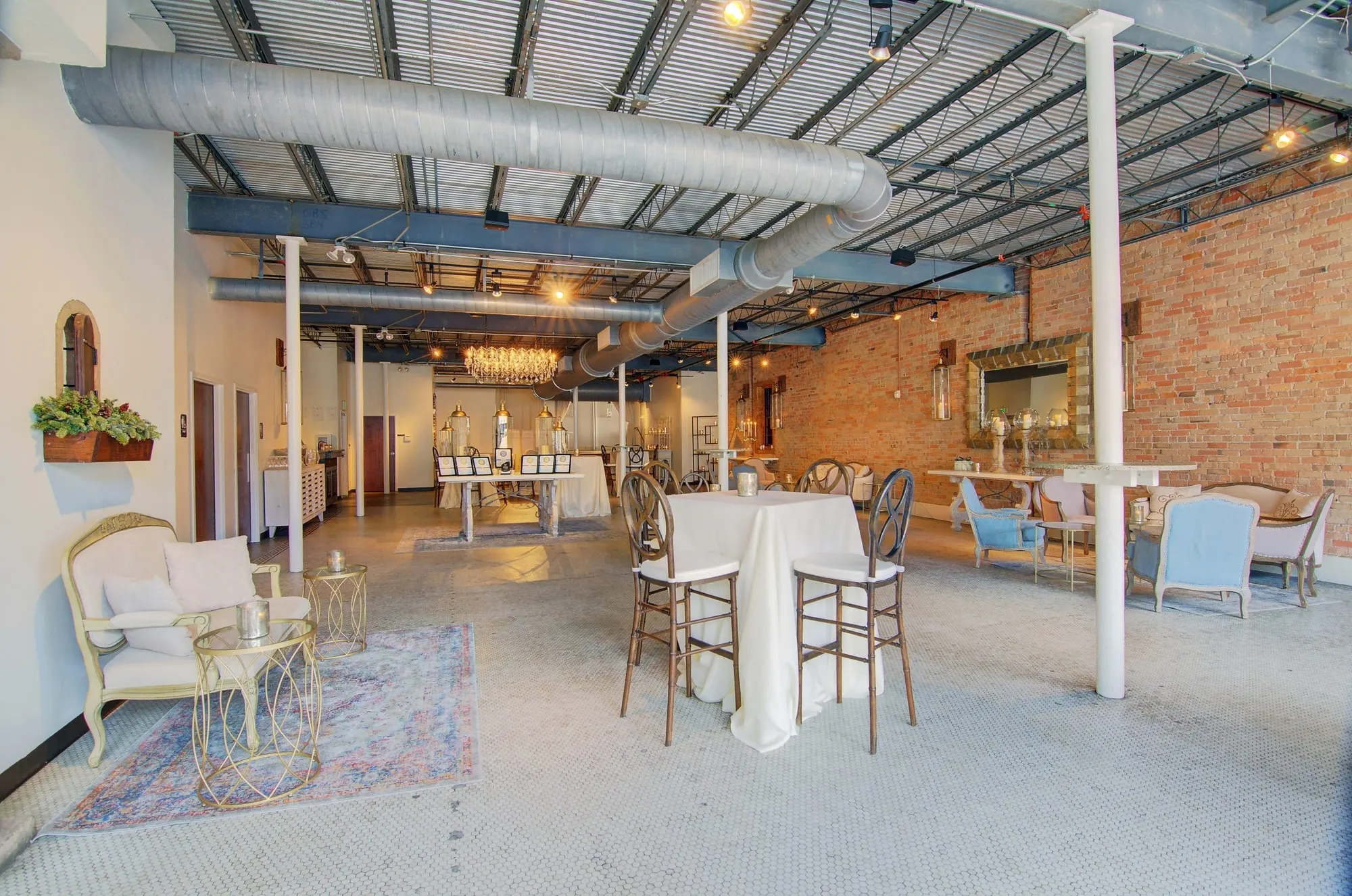 The bare Market level in daylight, high tables along the brick, showing the full span of the room