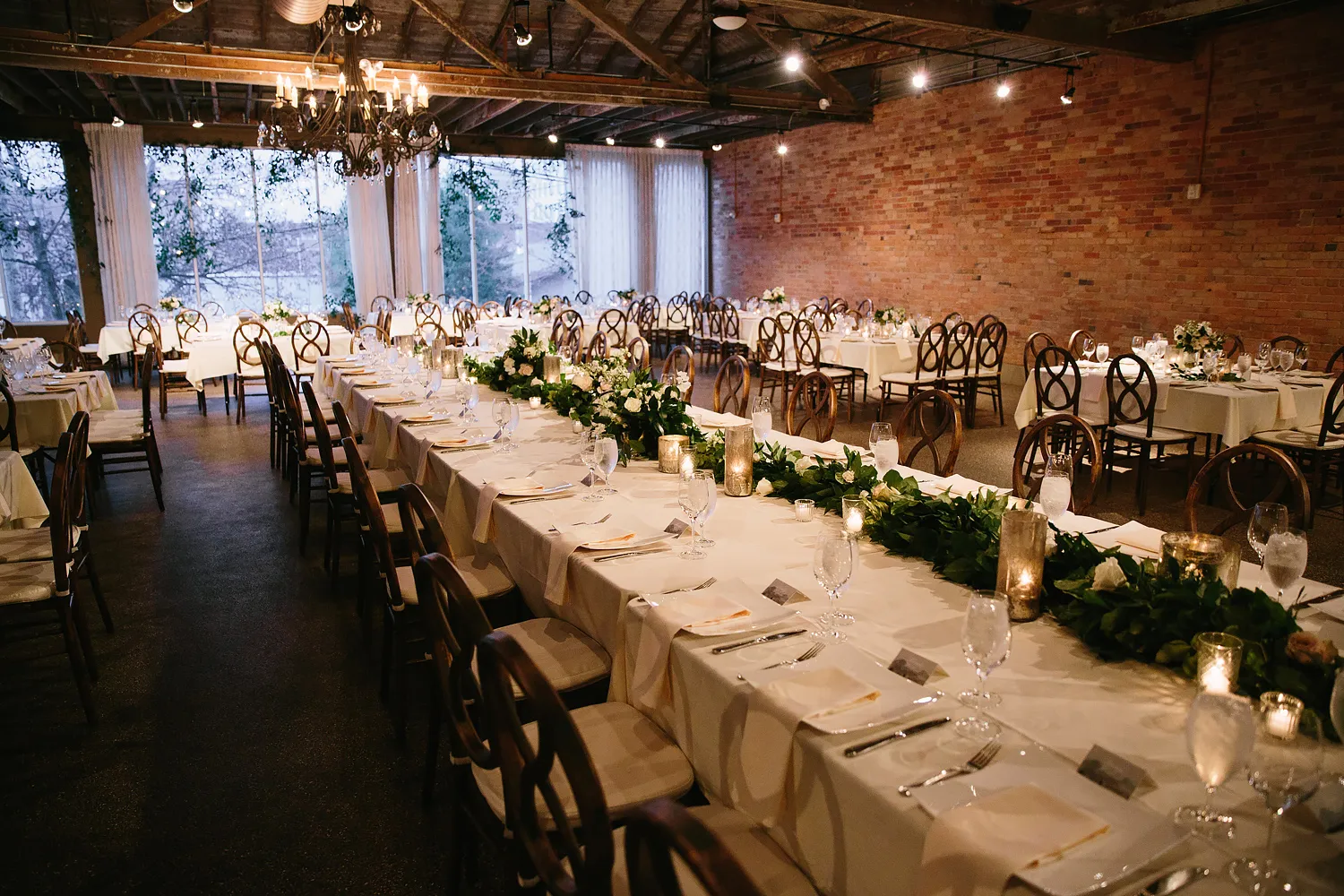 The Market and Mezzanine level at dusk, long tables set beneath string lights